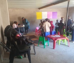 Children and caregivers during a Child Drop-in Centre session