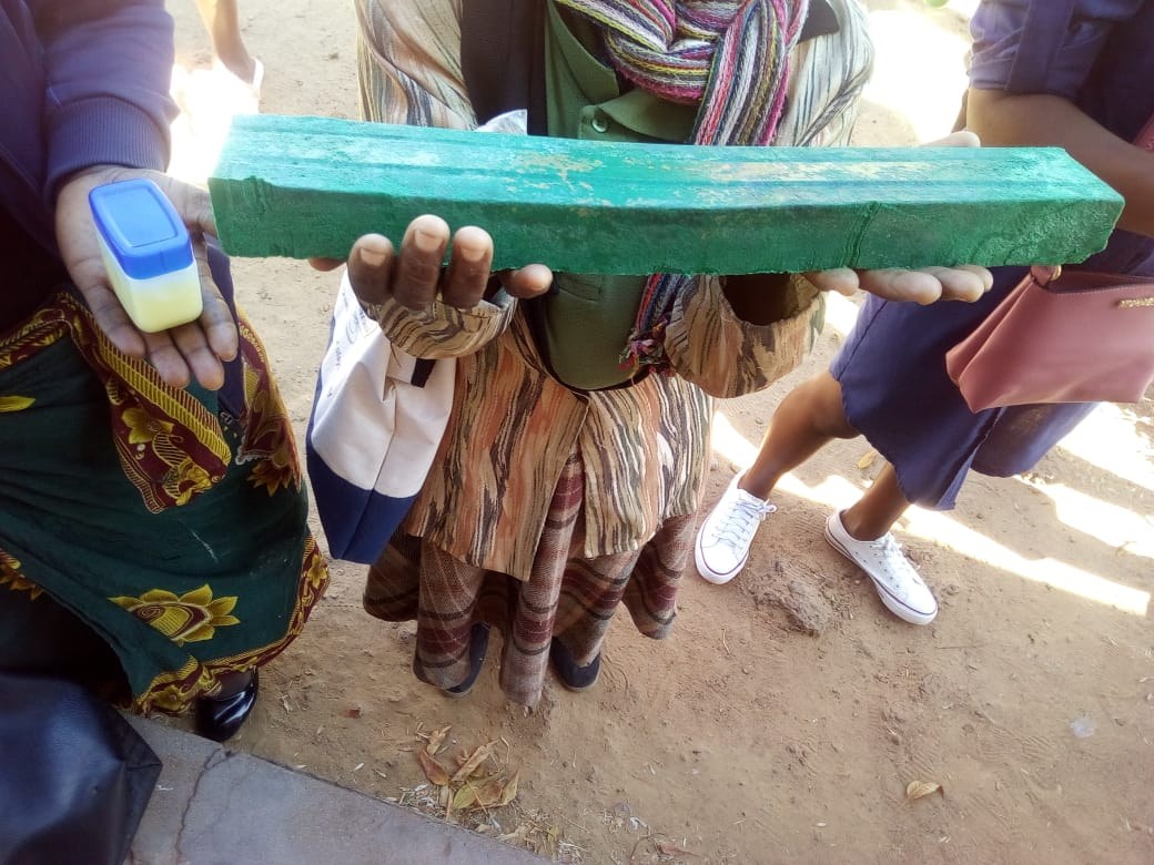 Hands holding a handmade product from skills training